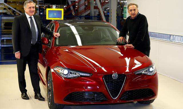 FILE PHOTO: FCA CEO Sergio Marchionne and Alfredo Altavilla Chief Operating Officer EMEA pose next to the new Alfa Romeo car Giulia during an event at an FCA plant in Cassino