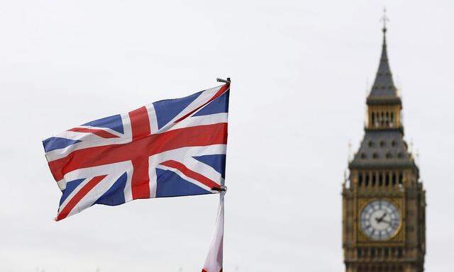 A Union Jack flags flies opposite Big Ben and the Houses of Parliament in central London