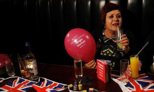 A woman holds a Pro-Brexit balloon in a pub at an event to celebrate the invoking of Article 50 after Britain´s Prime Minister Theresa May triggered the process by which the United Kingdom will leave the European Union, in London