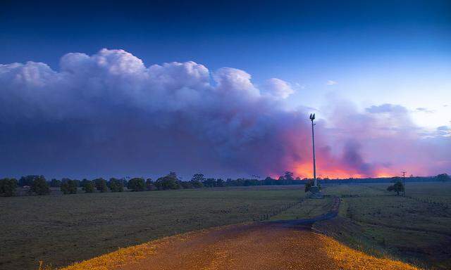 BUSHFIRES NSW, ***FILE***Smoke and fire is seen in the distance near Rainbow Flats, NSW, Friday, November 8, 2019. At l