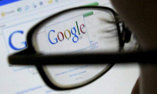 A Google search page is seen through the spectacles of a computer user in Leicester