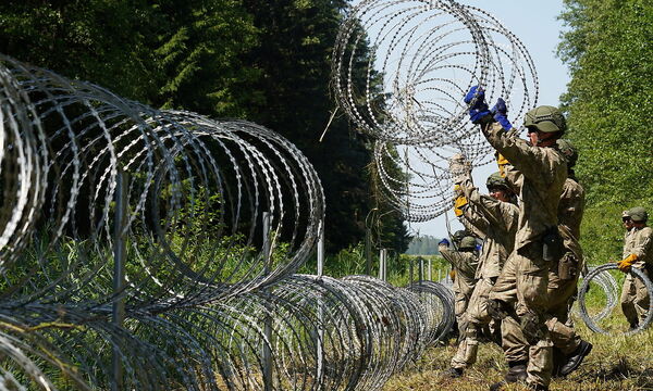 Lithuania toughens Belarus border with razor wire to bar migrants
