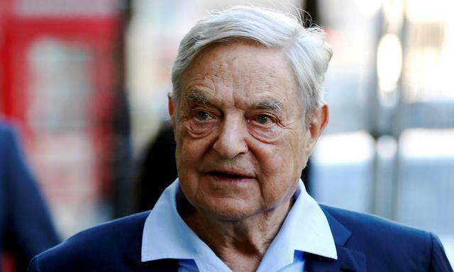 FILE PHOTO: George Soros arrives to speak at the Open Russia Club in London