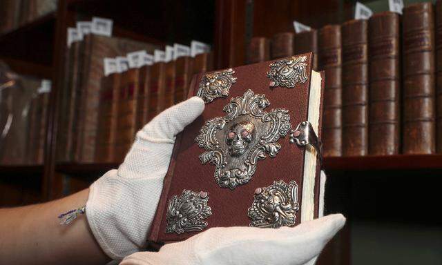 A copy of ´The Tales of Beedle the Bard´, handwritten and illustrated by Harry Potter author JK Rowling, is displayed at Sotheby´s auction house in London