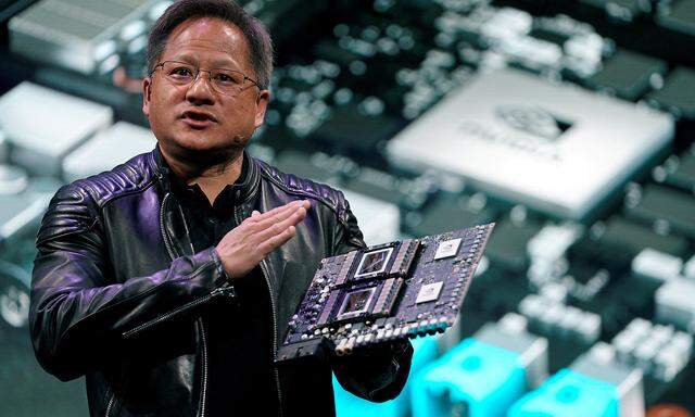 FILE PHOTO: Jensen Huang, CEO of Nvidia, shows the Drive Pegasus robotaxi AI computer at his keynote address at CES in Las Vegas