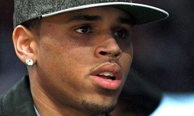 Recording artist Chris Brown attends the NBA basketball game between the Boston Celtics and the Los A