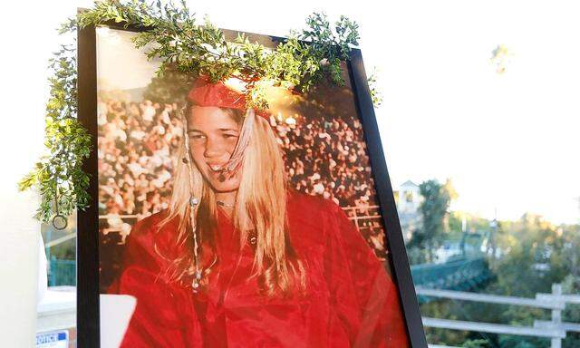 October 19, 2021, California, USA: A large portrait of Kristin Smart in graduation attire is on display at a candlelight
