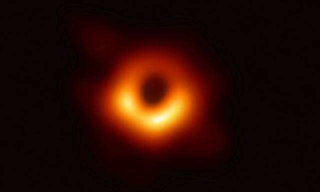 Handout of the first ever photo of a black hole, taken using a global network of telescopes, conducted by the Event Horizon Telescope (EHT) project