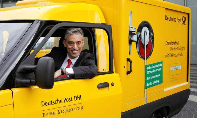 FILE PHOTO: DHL CEO Appel looks out of a StreetScooter E-car in Bonn
