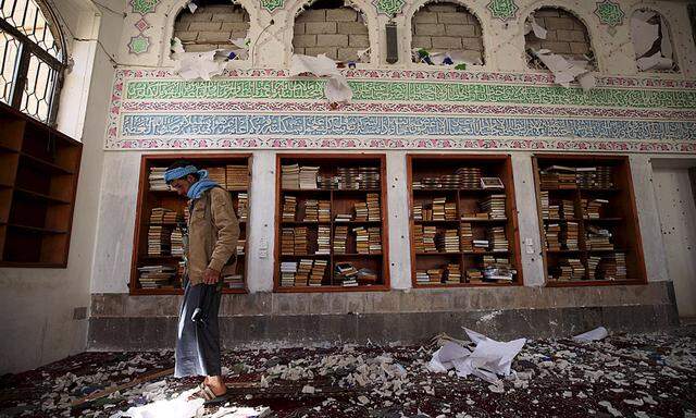 Houthi militant looks on after a suicide bomb attack at a mosque in Sanaa