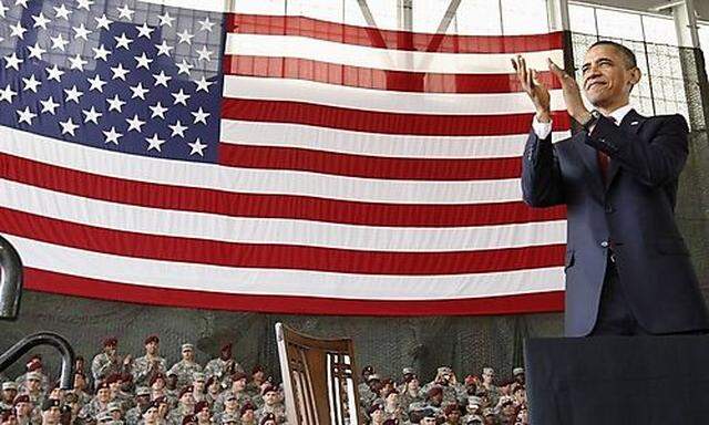 U.S. President Barack Obama applauds troops at Fort Bragg in North Carolina