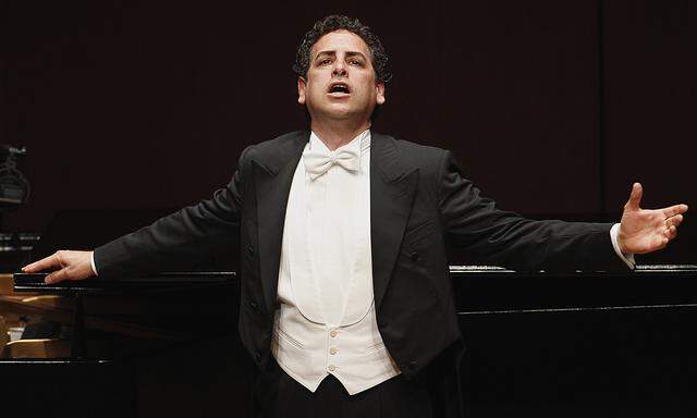 Peruvian tenor Juan Diego Florez gestures during a concert with pianist Vincenzo Scalera at Lima´s National Theatre