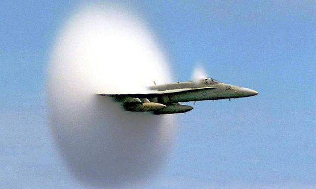 Handout file photo shows Lieutenant Ron Candiloro, assigned to Fighter Squadron One Five One, breaking the sound barrier in an F/A-18 Hornet fighter plane