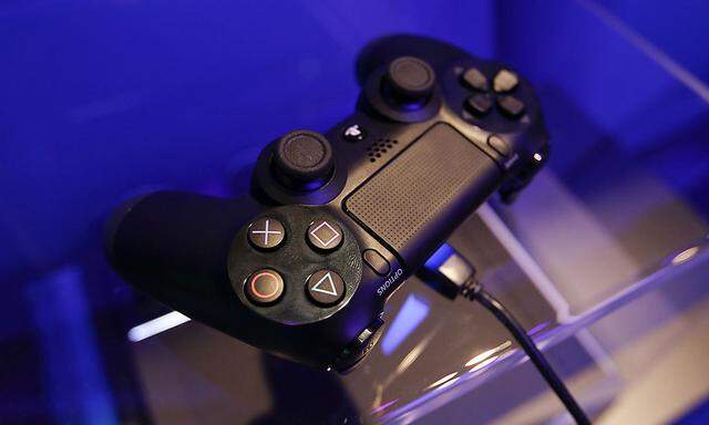 A controller of a Playstation 4 is pictured at the Sony exhibition stand during the Gamescom 2013 video games trade fair in Cologne