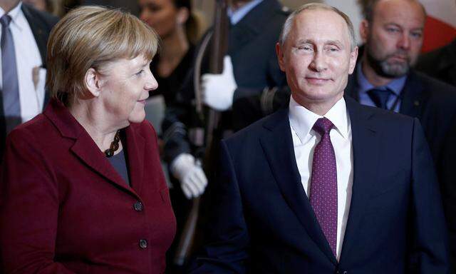 German Chancellor Merkel welcomes Russian President Putin for talks on a stalled peace plan for eastern Ukraine at the chancellery in Berlin