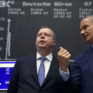 Peter Terium, CEO of RWE and Carsten Kengeter, CEO of Deutsche Boerse chat at the stock exchange in Frankfurt