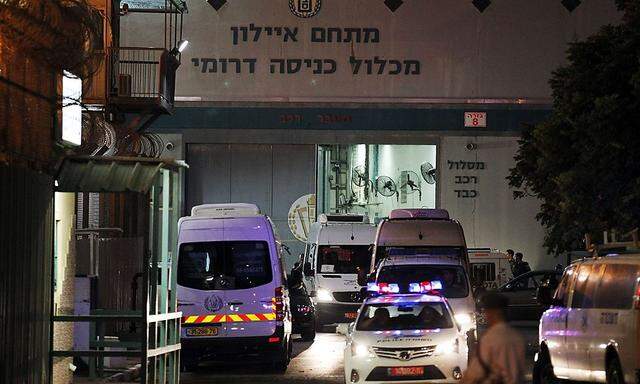 Israeli Prisons Authority vans carrying Palestinian prisoners due for release to help underpin peace talks drive out of Ayalon prison near Lod, on its way to the crossing between Israel and Gaza