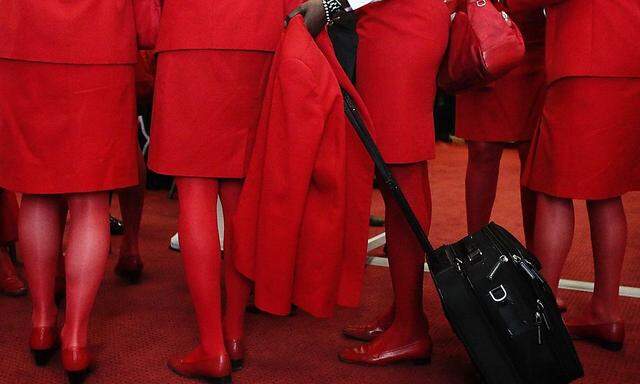 Austrian Airlines AUA staff members arrive for a works council meeting at the airport in Schwechat