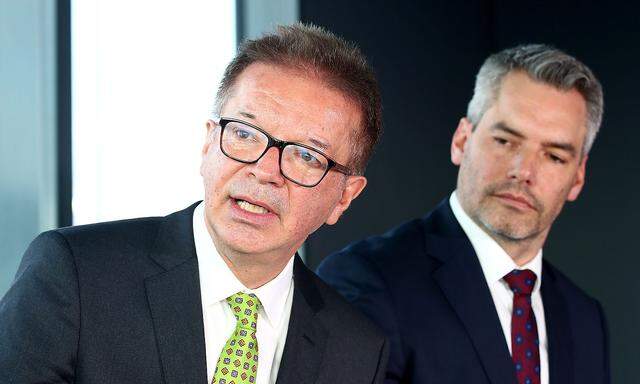 Austrian Health Minister Rudolf Anschober and Interior Minister Karl Nehammer address a news conference in Schwechat