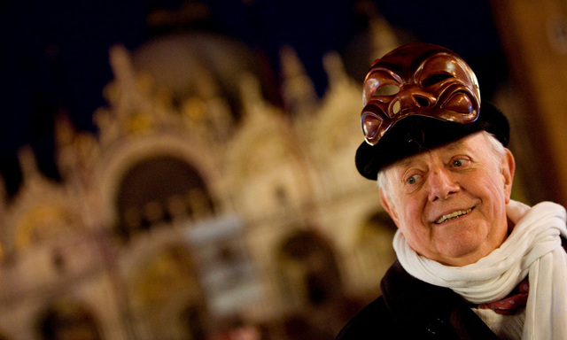 Dario Fo, Italy´s Nobel laureate playwright, smiles as he poses with a mask in front of St Mark basilic during the Venetian Carnival in Venice
