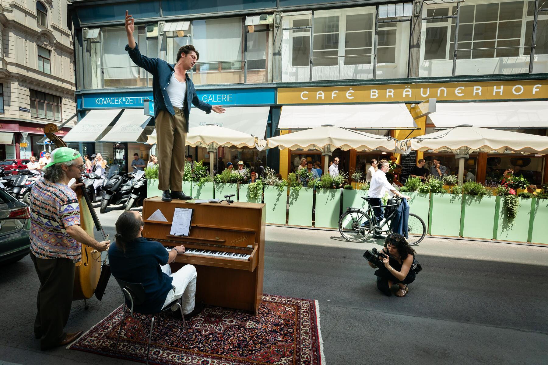 Emperor and toilet brush: Performance art marks Vienna cafe's reopening