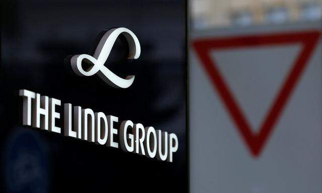 Linde Group logo is pictured close to a traffic sign near its headquarters in Munich