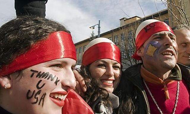 Ethnic Albanians gather in the main square of Kosovo capital Pristina to celebrate one year anniversa