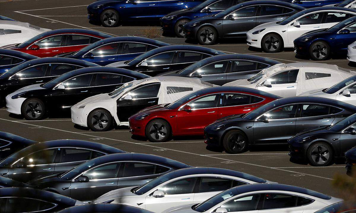 FILE PHOTO: Rows of new Tesla Model 3 electric vehicles in Richmond California