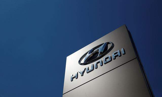 FILE PHOTO: A shop sign of Hyundai is seen outside a car showroom in Bletchley, Milton Keynes, Britain