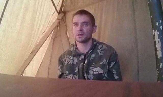 A man who identified himself as Russian serviceman Alexei Generalov speaks in this still image from video