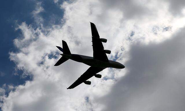 An Airbus A380, the world's largest jetliner is silhouetted in the sky as he participates a flying display during the 51st Paris Air Show at Le Bourget airport near Paris