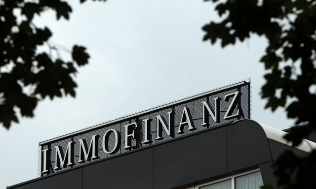 The logo of Austrian real estate group Immofinanz is pictured on top of the company's headquarters building in Vienna