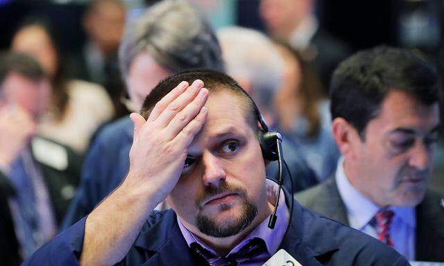 A trader works on the floor of the New York Stock Exchange (NYSE) in Manhattan in New York