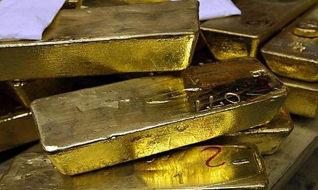 FILE - In this May 13, 2008 file photo, gold standard bars are piled up at the gold smelter company A