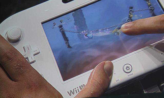 Nintendo´s Wii U tablet is shown on a large video screen as it is used to play the video game ´Rayman Legends´ at the Ubisoft press briefing during the E3 game expo in Los Angeles