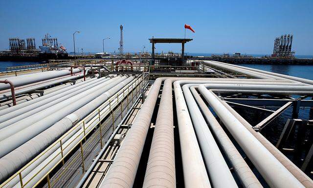 FILE PHOTO: An oil tanker is being loaded at Saudi Aramco's Ras Tanura oil refinery and oil terminal in Saudi Arabia