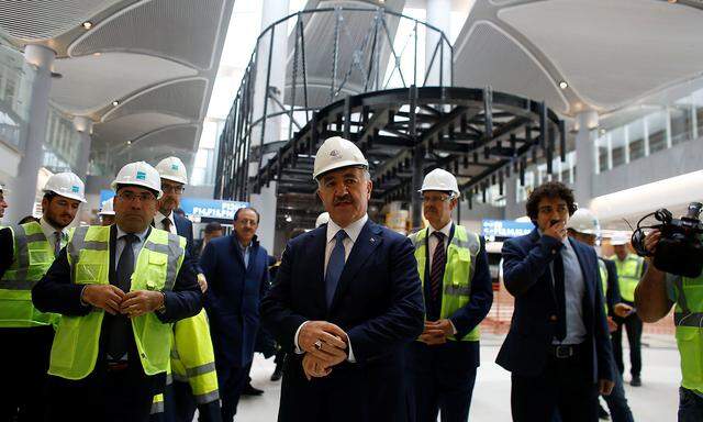 Transport and Maritime Minister Ahmet Arslan walks through the construction area of Istanbul´s third international airport