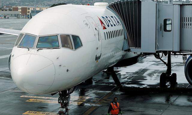 A Delta Airlines plane is seen at a gate in San Diego