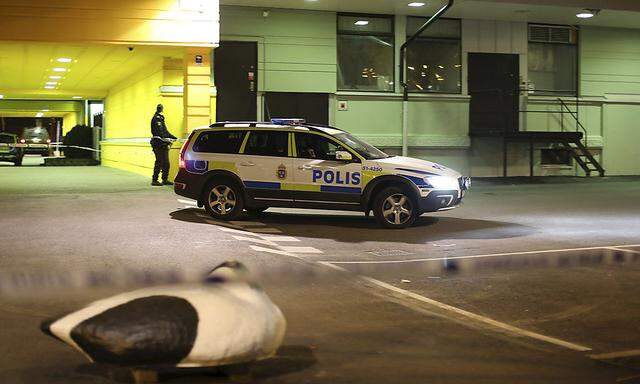 Police officer stands at the scene of a fatal shooting in Gothenburg,