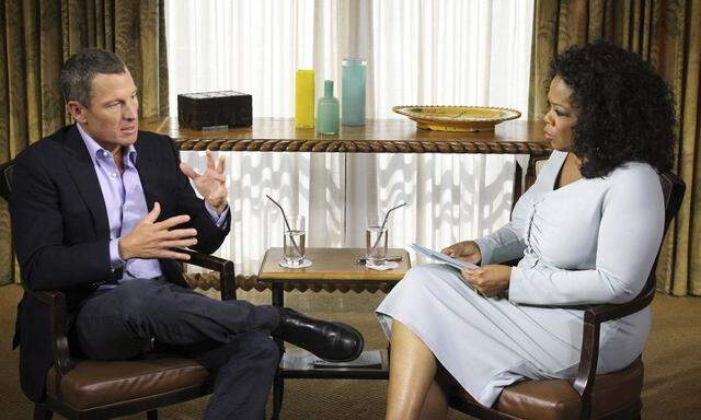 Handout photo of Lance Armstrong speaking with Oprah Winfrey in Austin