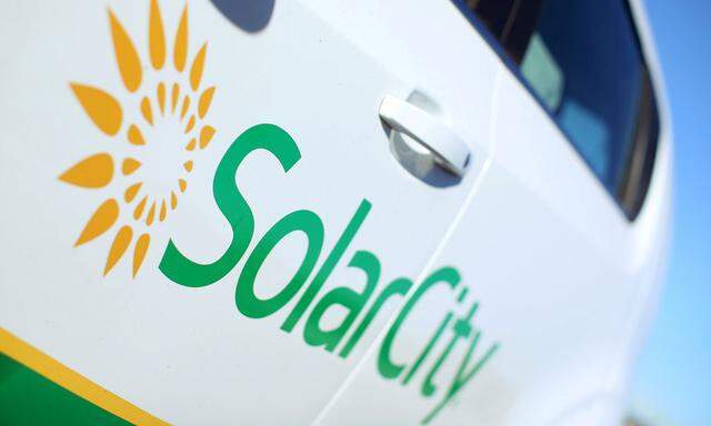 A Solar City logo is seen on the side of a company vehicle in San Diego, California