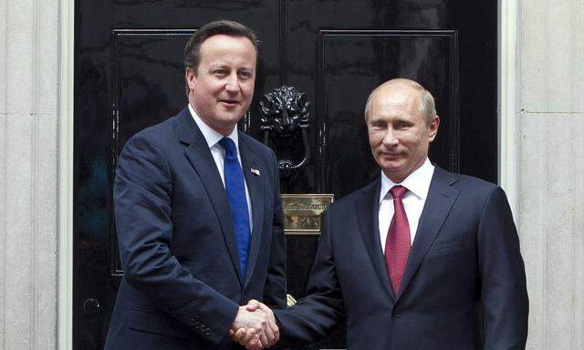 Russian President Vladimir Putin meets Prime Minister David Cameron at Downing Street in London
