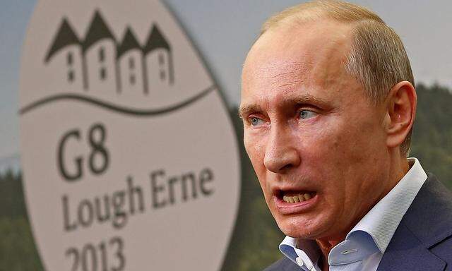 Russia's President Putin holds a news conference at the end of a G8 summit in Enniskillen