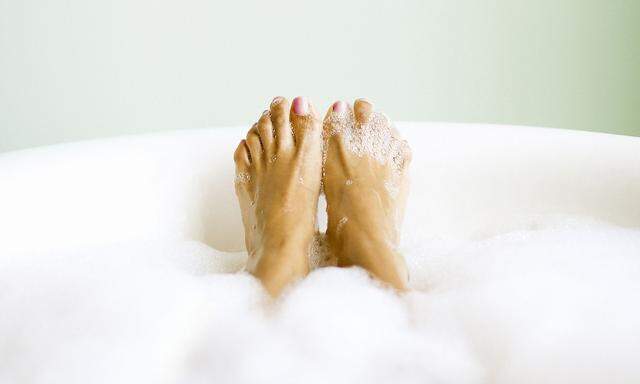 Woman's Feet Emerging in Bubble Bath