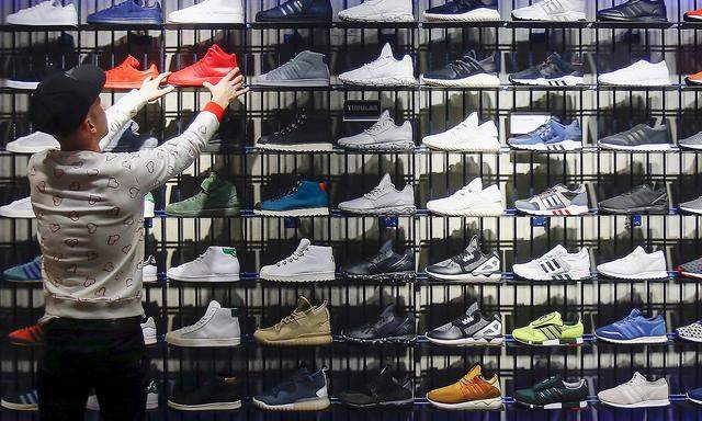 A shop assistant works at the Adidas flagship store in Berlin