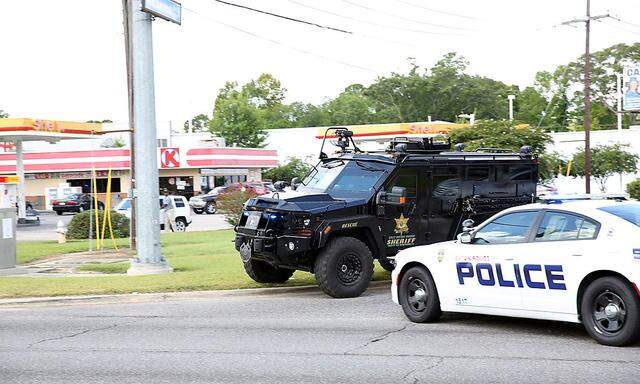 Police officers block off a road after a shooting of police in Baton Rouge