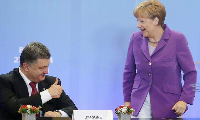 Archivbild aus dem Jahr 2014: Poroschenko mit Merkel.