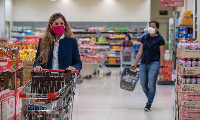 February 12, 2020, Hong Kong, China: Shoppers seen wearing protective face masks as they shop in a supermarket..Panic g