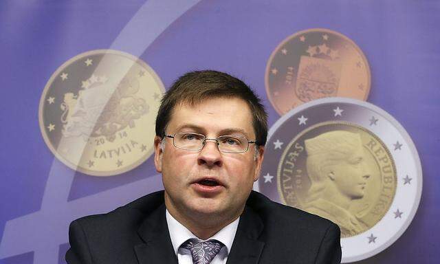 Latvia's PM Dombrovskis addresses a news conference on the adoption of the euro by Latvia at the EU council building in Brussels