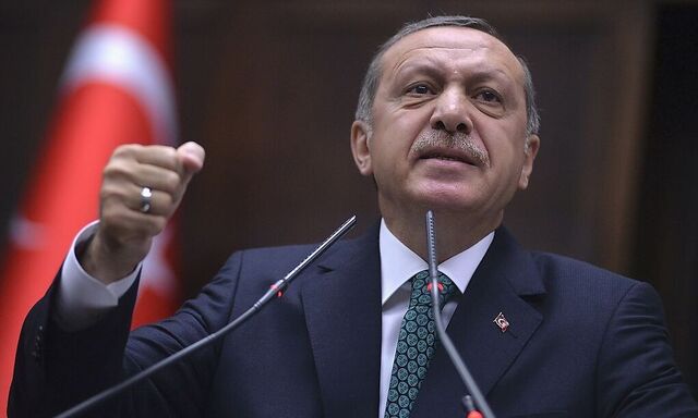 Turkey´s Prime Minister Tayyip Erdogan addresses members of parliament from his ruling AK Party during a meeting at the Turkish parliament in Ankara